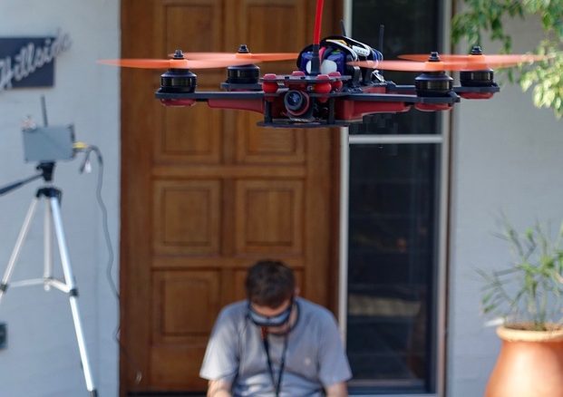 man flying drone